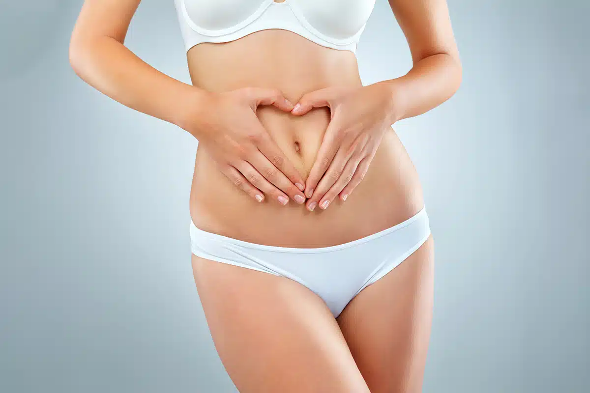 Woman hands and stomach with underwear